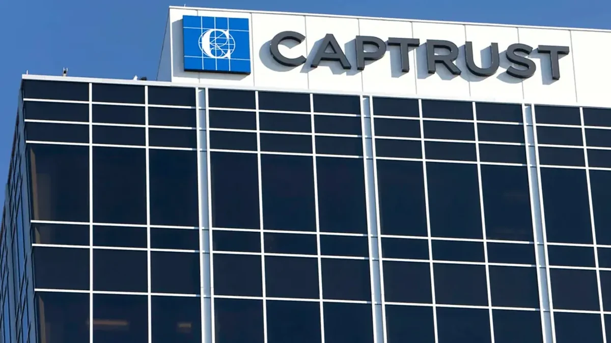 The CAPTRUST headquarters building: a glass tower with the CAPTRUST name and logo mounted along the roofline